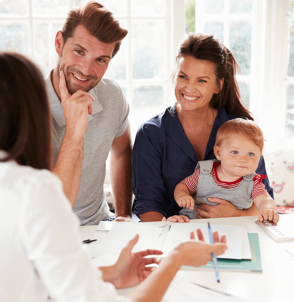 Family consulting with professional in office setting.